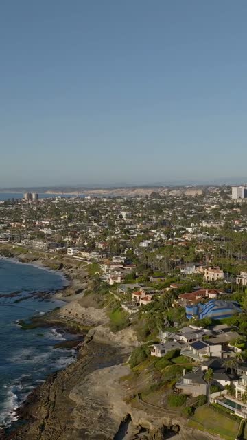 Aerial view of the cliffs, palm trees and the ocean at Beach Barber Tract.