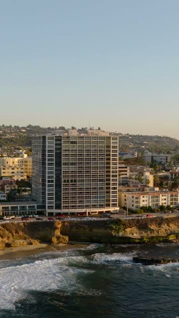 Aerial view of the cliffs, the ocean and homes at La Jolla Cove.