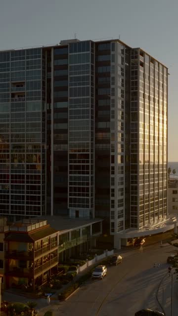Low aerial view of the downtown streets, the buildings and the city at La Jolla Cove.
