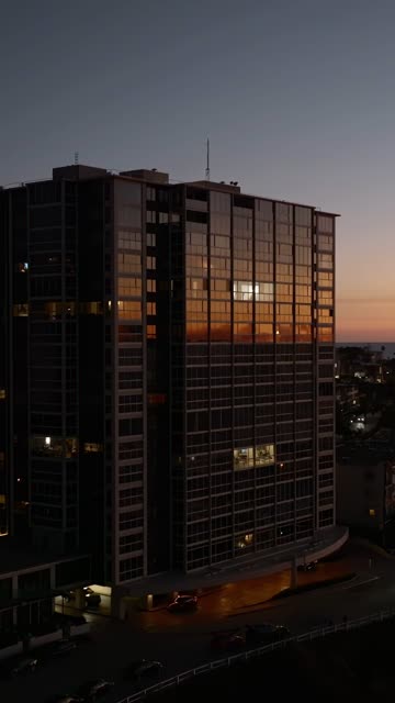 Low aerial view of the downtown streets, the buildings and the city at La Jolla Cove.
