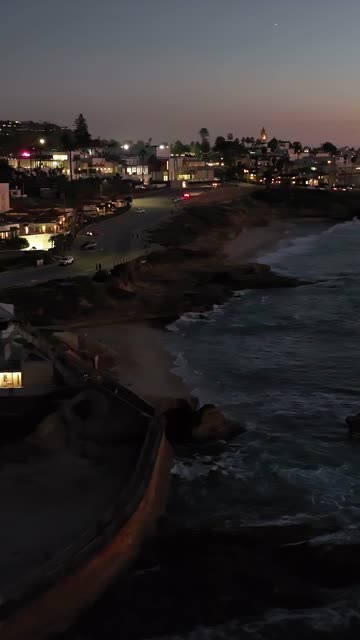 Aerial view of the cliffs, the ocean and homes at La Jolla Cove.