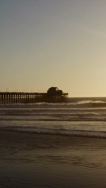 The beach, the surf and the pier in Oceanside.