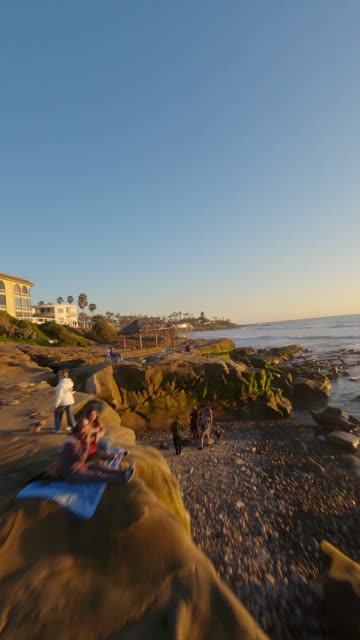 FPV drone video flying above Windansea Beach in La Jolla California highlighting coastal scenery surf lineup rocky shoreline and sunset glow | Vertical FPV Drone Video – 1