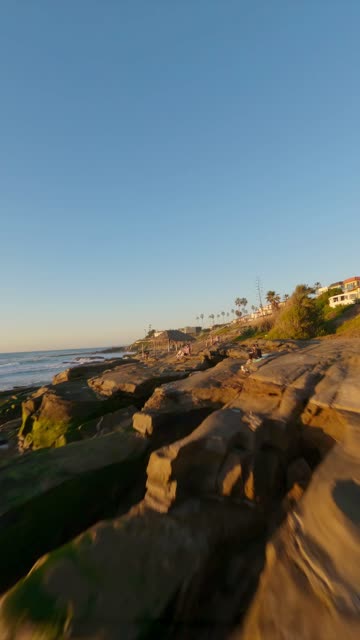 FPV drone video flying above Windansea Beach in La Jolla California highlighting coastal scenery surf lineup rocky shoreline and sunset glow | Vertical FPV Drone Video – 2