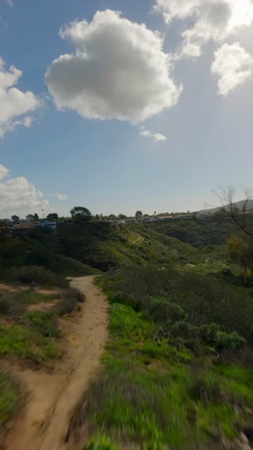 Low aerial view of the country inland, homes and open country at La Jolla Shores.