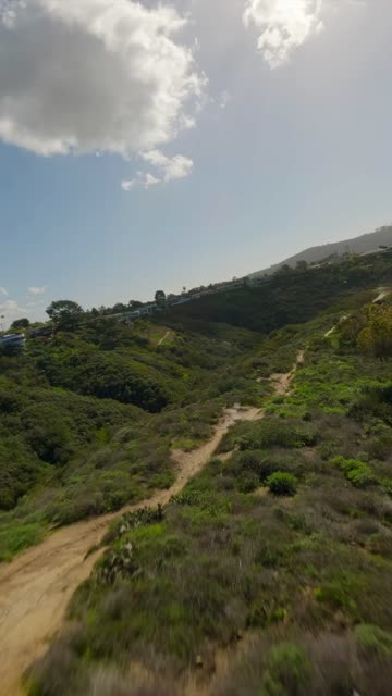 Low aerial view of the country inland and open country at La Jolla Shores.