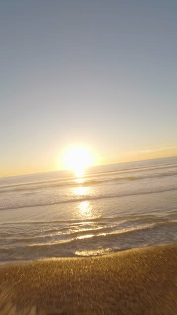 The beach, the surf and the ocean at Moonlight Beach.