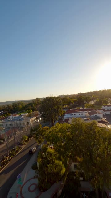 Low aerial view of the downtown streets, homes and the buildings at Covenant.