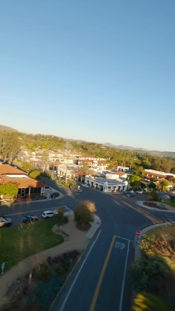 Low aerial view of the country inland, homes and the buildings at Covenant.