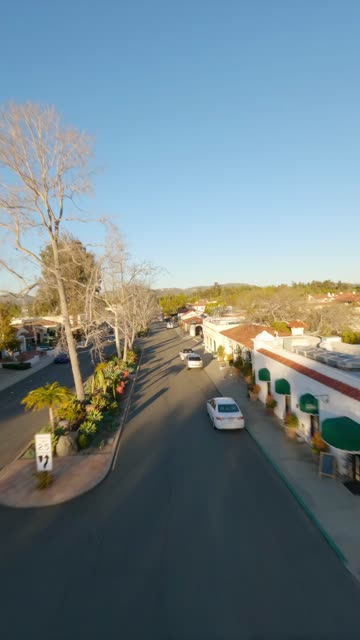 Low aerial view of the downtown streets, homes and the buildings at Covenant.