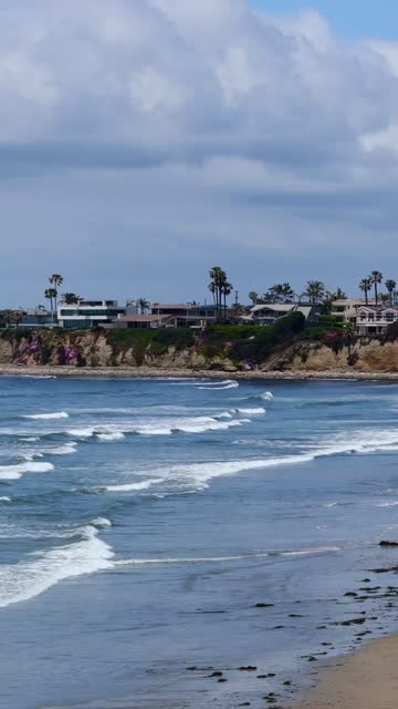 Vertical drone video of surfers at Tourmaline Beach Park in Pacific Beach San Diego California riding clean waves at a classic local surf break | Vertical Drone Video – 6