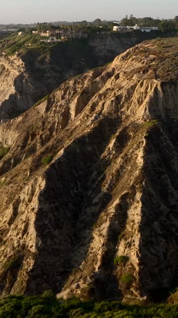 Aerial view of the cliffs, homes and open country at Black’s Beach.