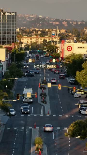 Low aerial view of the downtown streets, the skyline and the buildings in North Park, with people walking.