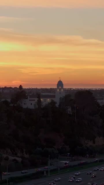Vertical drone video of the Junípero Serra Museum in Presidio Park near Mission Hills San Diego California at sunset with warm golden light and historic architecture | Vertical Drone Video