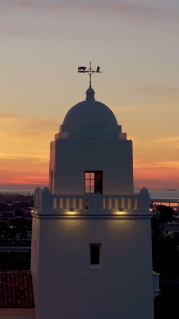 Vertical drone video of the Junípero Serra Museum in Presidio Park near Mission Hills San Diego California at sunset with warm golden light and historic architecture | Vertical Drone Video – 1
