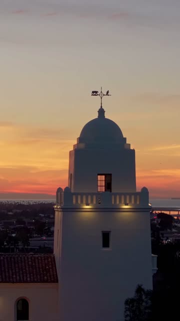 Vertical drone video of the Junípero Serra Museum in Presidio Park near Mission Hills San Diego California at sunset with warm golden light and historic architecture | Vertical Drone Video – 2
