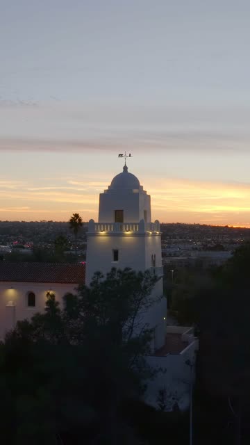 Vertical drone video of the Junípero Serra Museum in Presidio Park near Mission Hills San Diego California at sunset with warm golden light and historic architecture | Vertical Drone Video – 3
