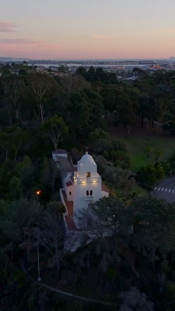 Vertical drone video of the Junípero Serra Museum in Presidio Park near Mission Hills San Diego California at sunset with warm golden light and historic architecture | Vertical Drone Video – 4