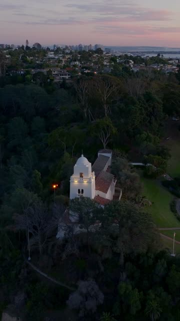 Vertical drone video of the Junípero Serra Museum in Presidio Park near Mission Hills San Diego California at sunset with warm golden light and historic architecture | Vertical Drone Video – 5