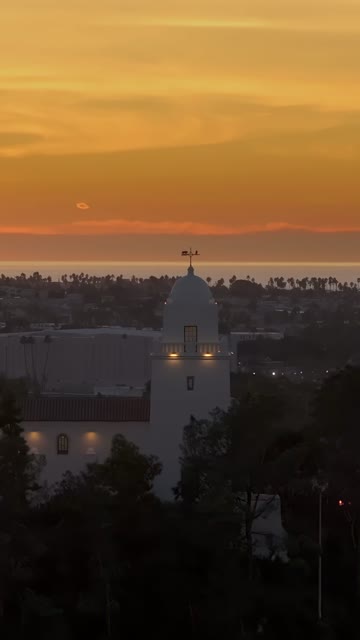 Vertical drone video of the Junípero Serra Museum in Presidio Park near Mission Hills San Diego California at sunset with warm golden light and historic architecture | Vertical Drone Video – 7