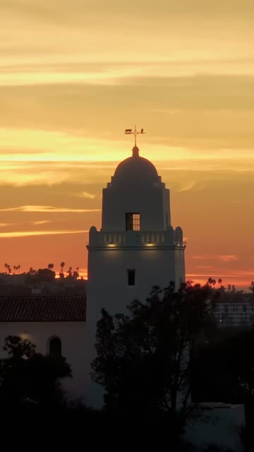 Vertical drone video of the Junípero Serra Museum in Presidio Park near Mission Hills San Diego California at sunset with warm golden light and historic architecture | Vertical Drone Video – 11