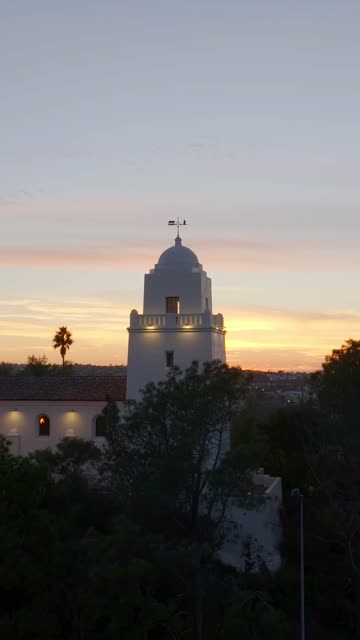 Vertical drone video of the Junípero Serra Museum in Presidio Park near Mission Hills San Diego California at sunset with warm golden light and historic architecture | Vertical Drone Video – 13