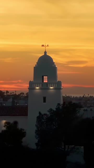 Vertical drone video of the Junípero Serra Museum in Presidio Park near Mission Hills San Diego California at sunset with warm golden light and historic architecture | Vertical Drone Video – 14