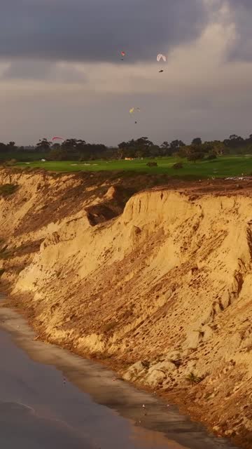 Aerial view of the cliffs, the beach and open country at Black’s Beach.
