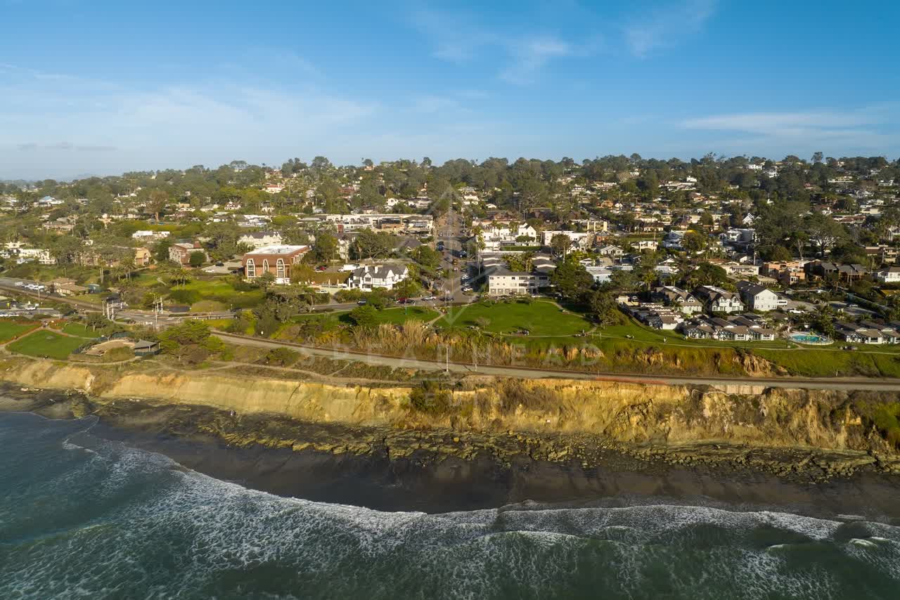 Aerial view of the cliffs, the surf and the ocean in Del Mar.