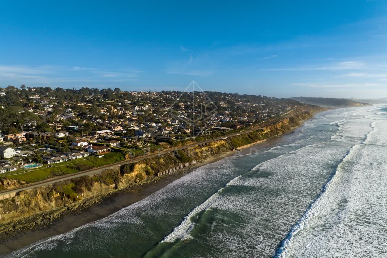 Aerial view of the cliffs, the surf and the ocean in Del Mar.