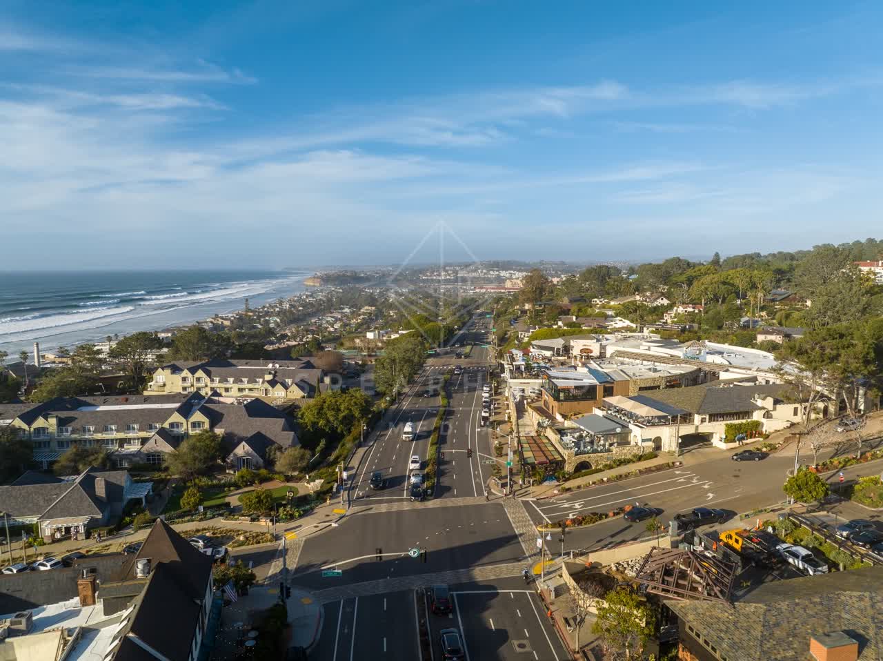 Aerial view of the downtown streets, the surf and palm trees in Del Mar.