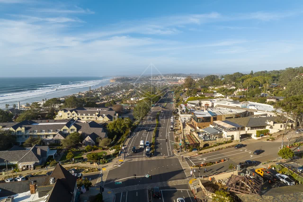 Aerial view of the beach, the ocean and homes in Del Mar.