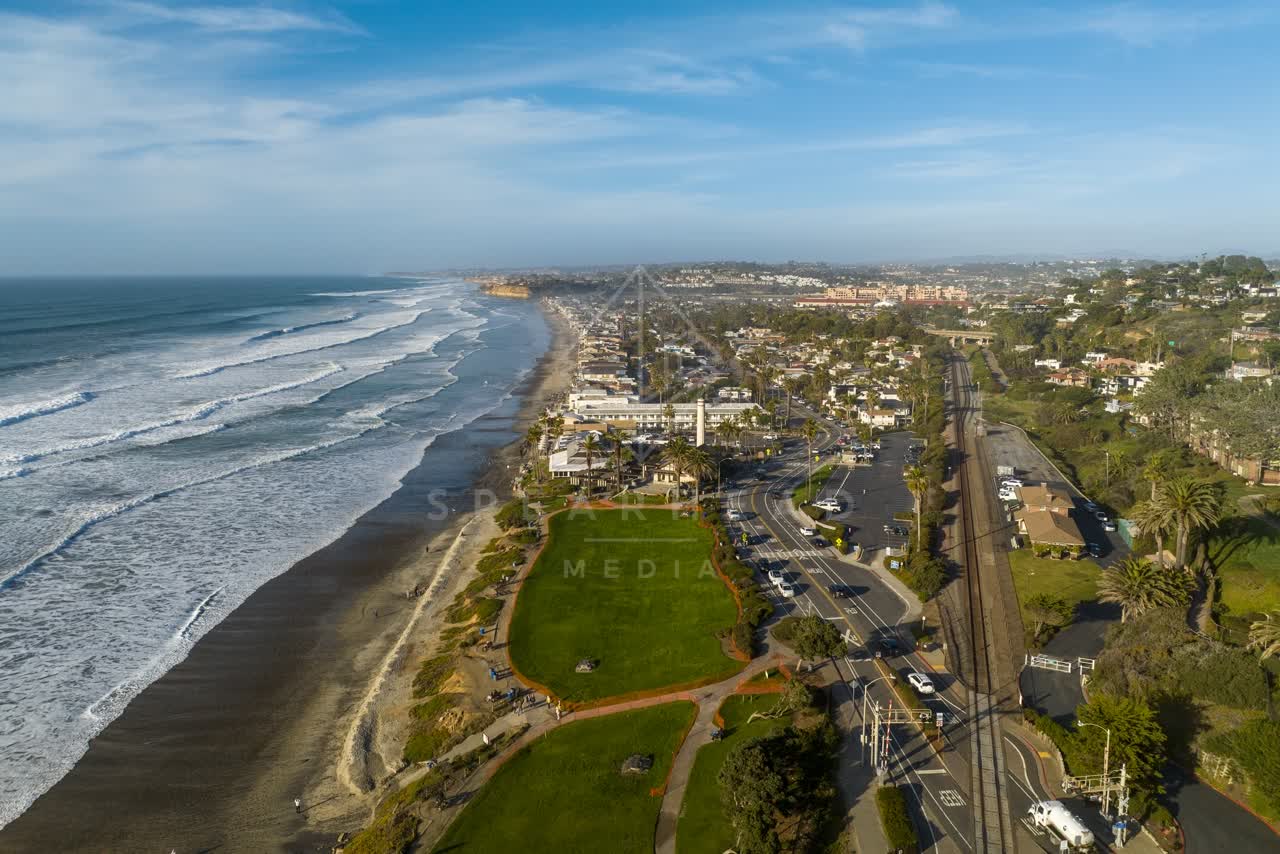 Aerial view of the beach, the surf and palm trees in Del Mar.