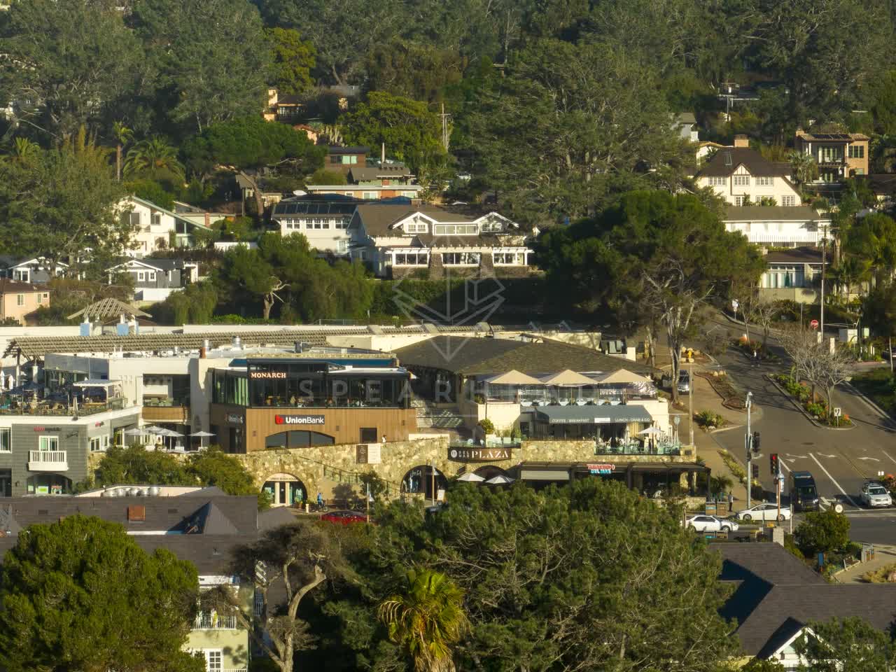 Low aerial view of the downtown streets, homes and the buildings in Del Mar.