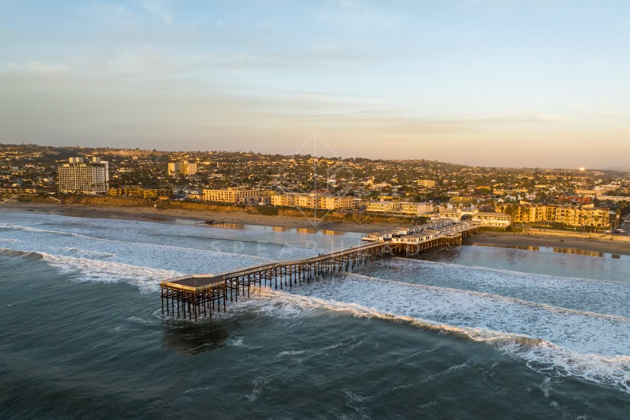 Aerial view of the beach, the surf and the pier in Pacific Beach.