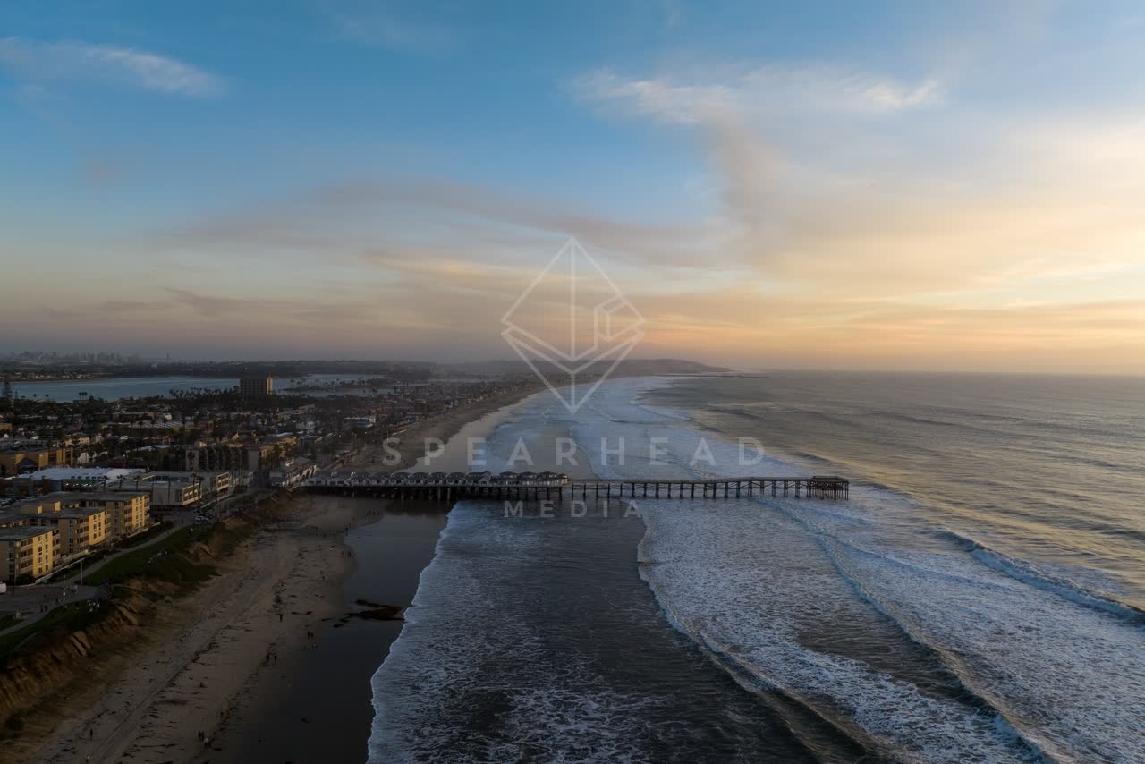 Aerial view of the beach, the surf and the pier in Pacific Beach.