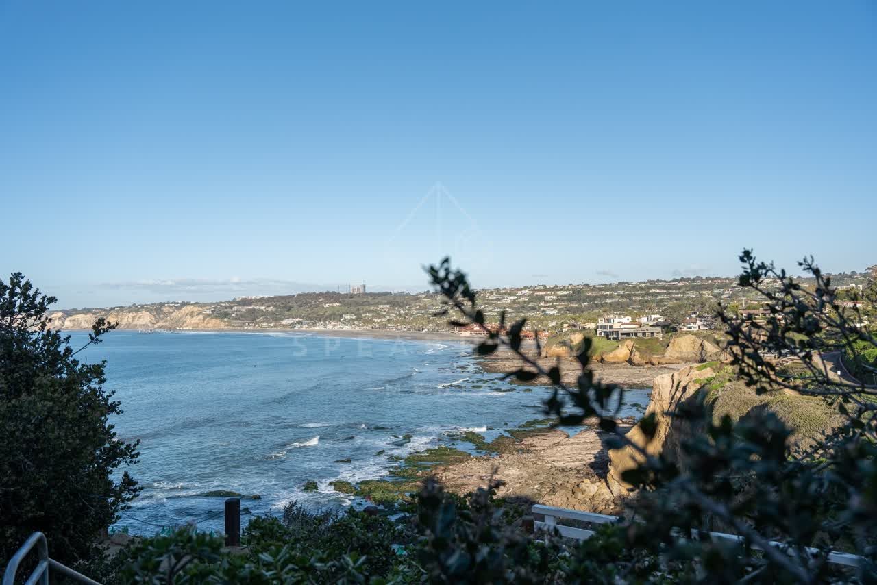 Elevated view of the cliffs, the ocean and homes at Coast Walk Trail.