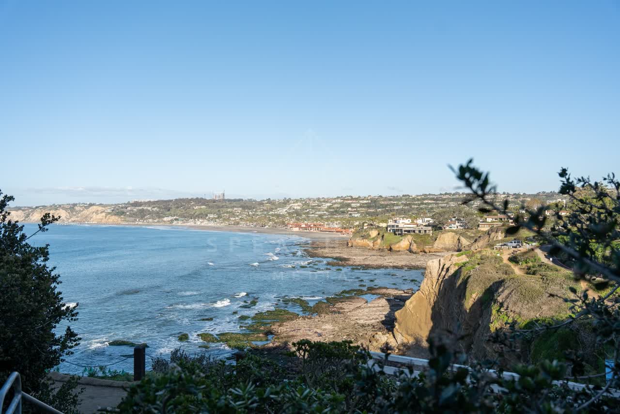 Elevated view of the cliffs, the ocean and homes at Coast Walk Trail.