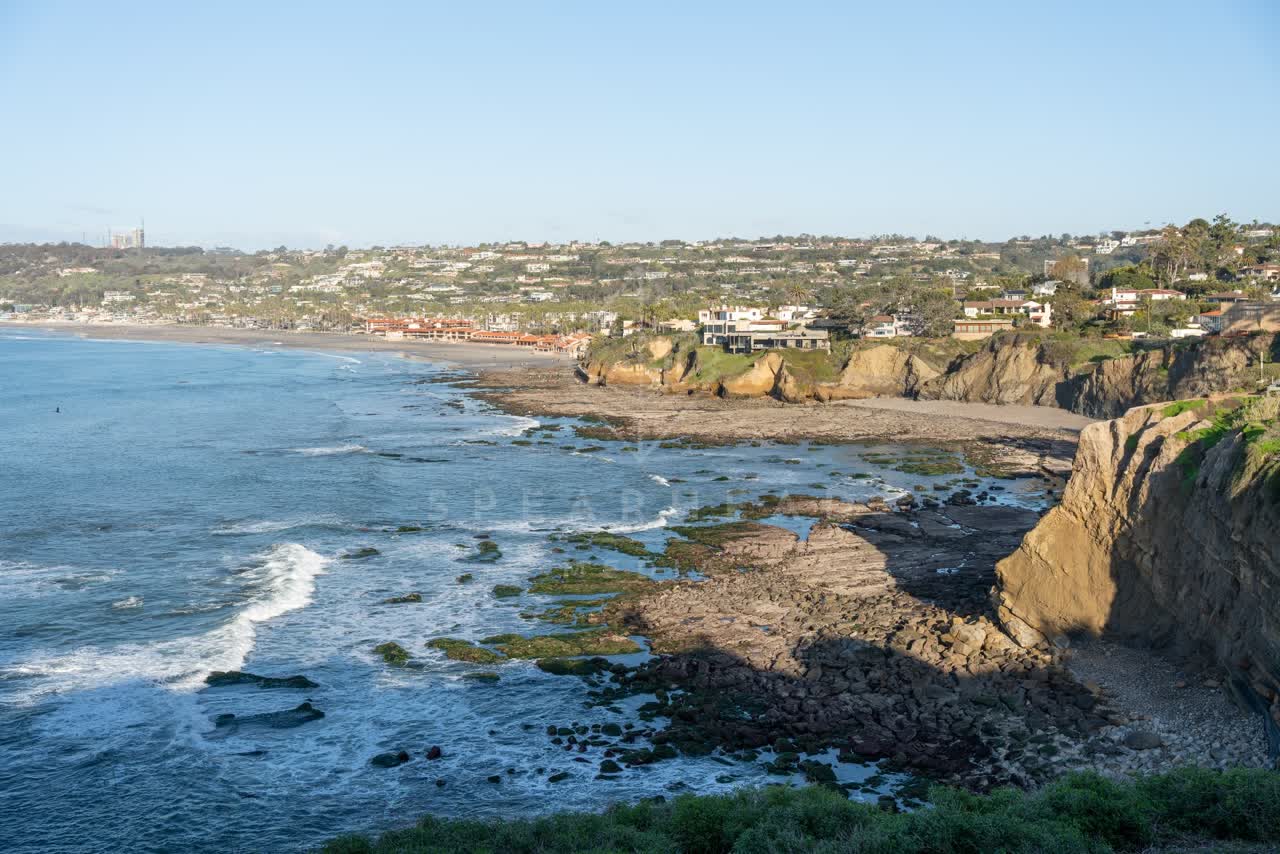 Elevated view of the cliffs, the surf and the ocean at Coast Walk Trail.