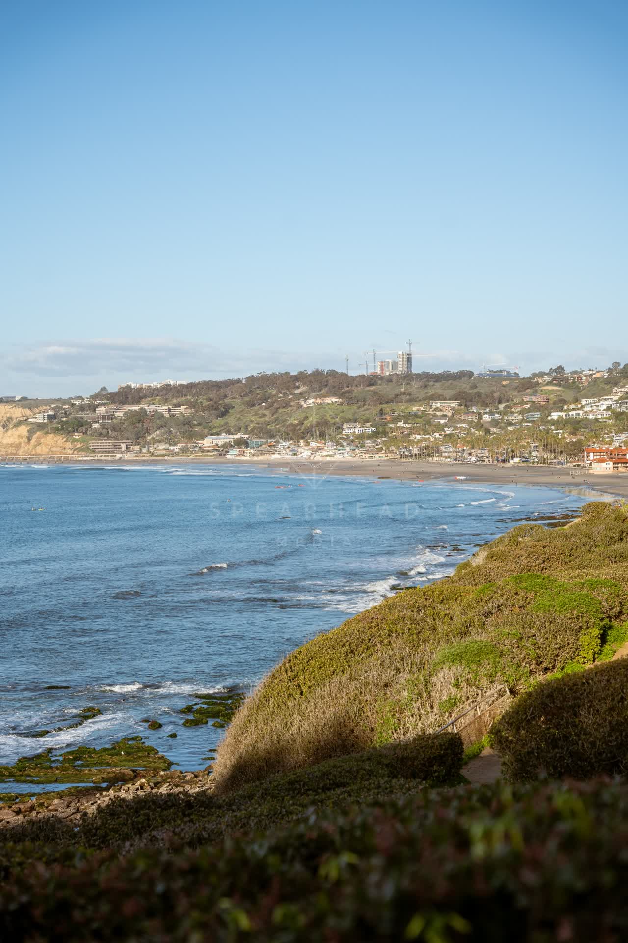 Elevated view of the cliffs, the surf and the ocean at Coast Walk Trail.