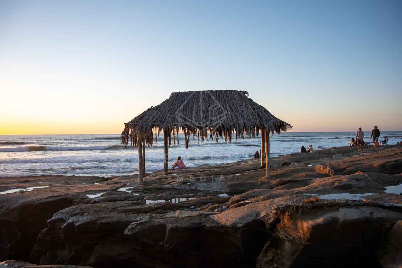The beach, the surf and the ocean at Windansea, with a crowd gathered.