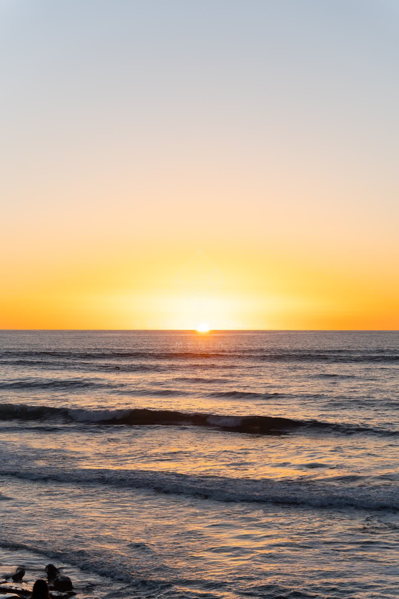View from the water of the beach, the surf and the ocean at Windansea.