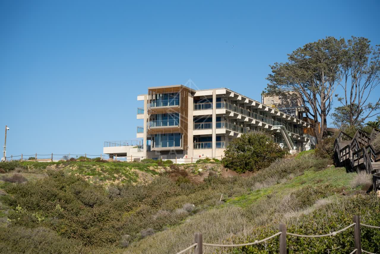 Elevated view of the cliffs, the buildings and open country at La Jolla Shores.