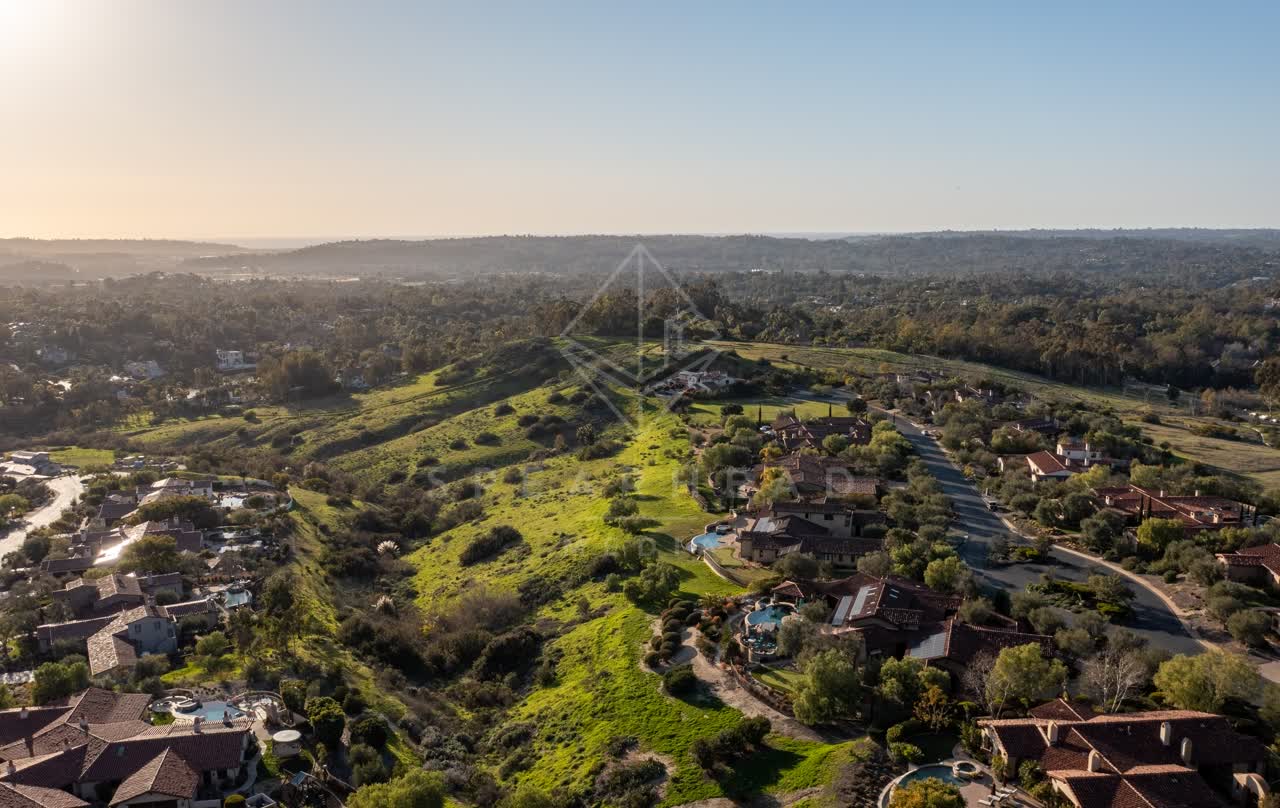 Aerial view of a residential street, homes and the buildings in Black Mountain Ranch.