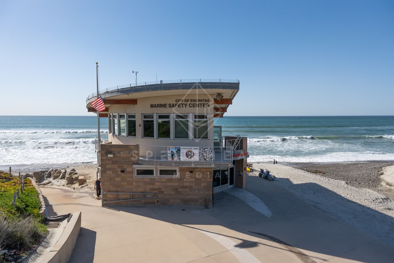 Elevated view of the beach, the surf and the ocean at Moonlight Beach.