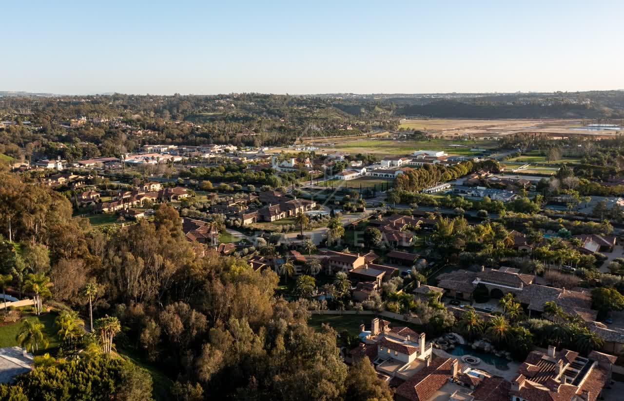 Aerial view of a residential street, homes and the buildings at Fairbanks Ranch.