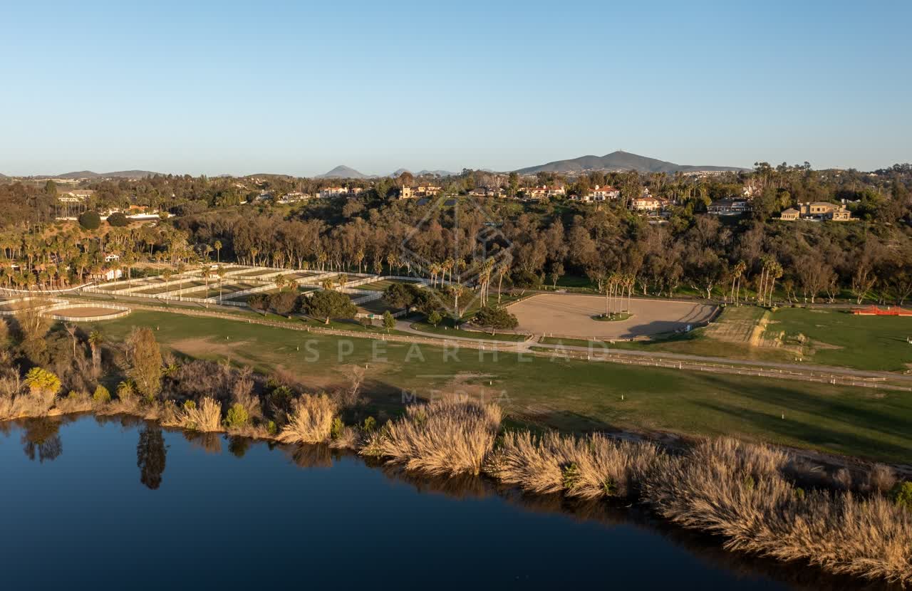 Aerial view of a residential street, homes and open country at Fairbanks Ranch.