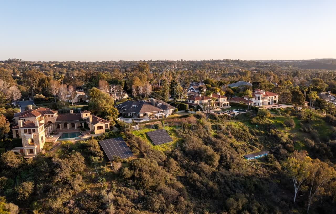 Aerial view of a residential street, homes and the buildings at Fairbanks Ranch.
