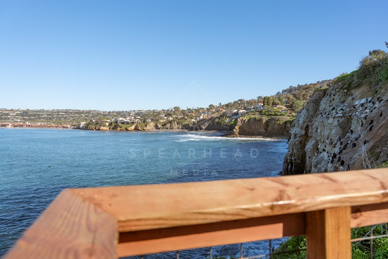 Elevated view of the cliffs, the ocean and homes at Coast Walk Trail.