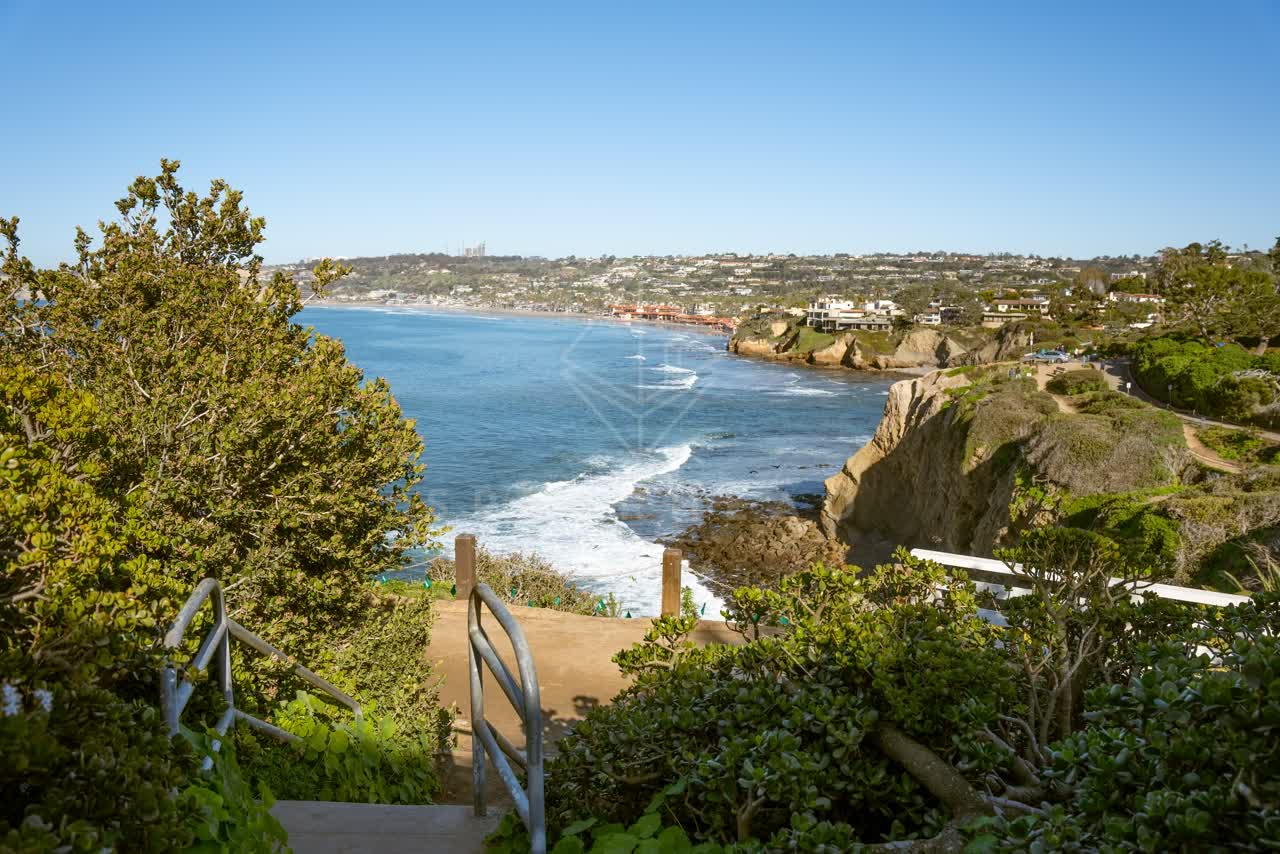 Elevated view of the cliffs, the surf and the ocean at Coast Walk Trail.